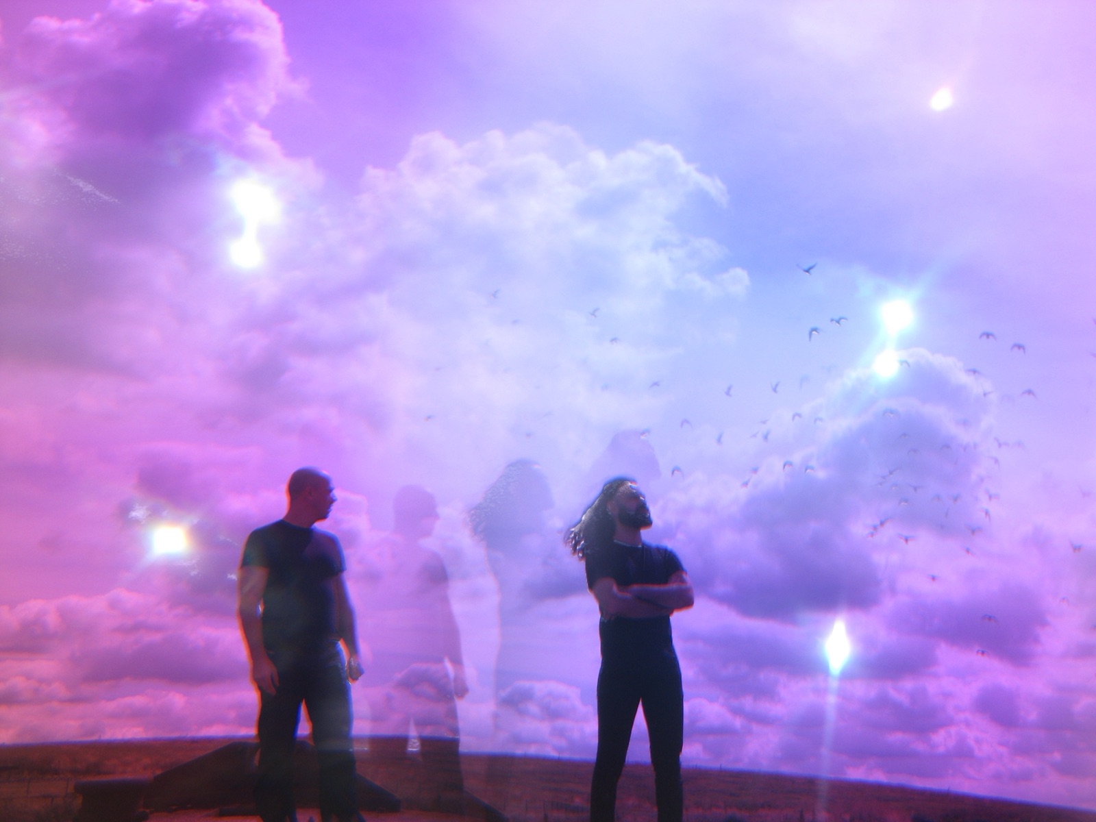 The two musicians stand beneath a violet sky while additional translucent figures and birds form a temporary expanded group.