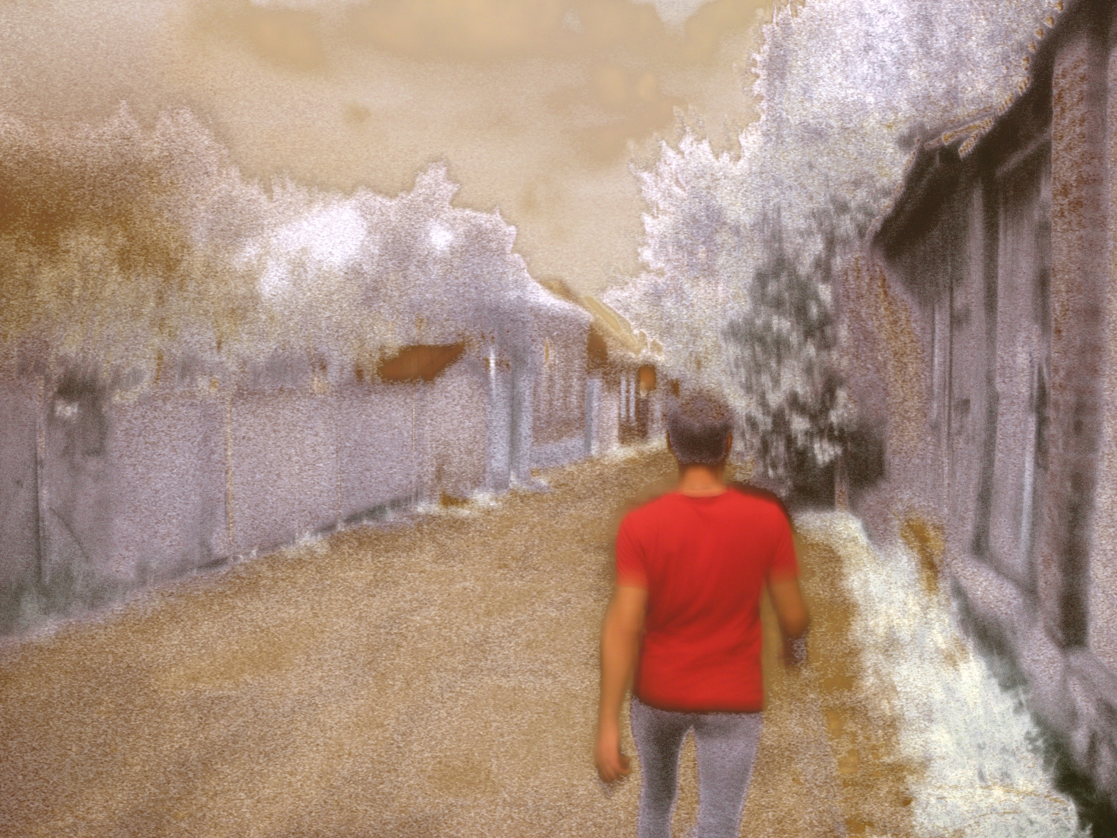 A red-clothed figure approaching through a street scene altered by flare and colour replacement.